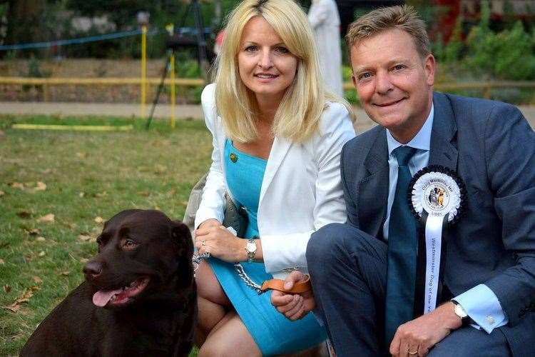 Chocolate Labrador, Libby, Kati Mackinlay and Thanet MP Craig Mackinlay. Picture: Office of Craig Mackinlay MP