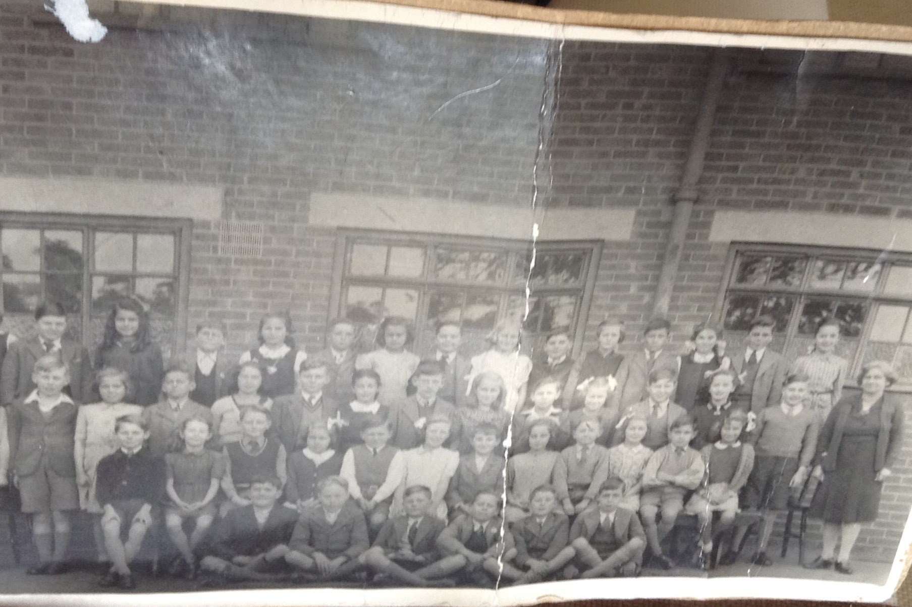 The top class at North Borough Primary School in 1947. Audrey Bigley is on the row behind sixth from the left with one bow in her hair. Miss Roots was the form teacher