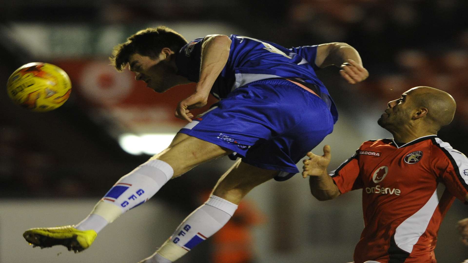 John Marquis heads towards goal for Gillingham at Walsall. Picture: Barry Goodwin