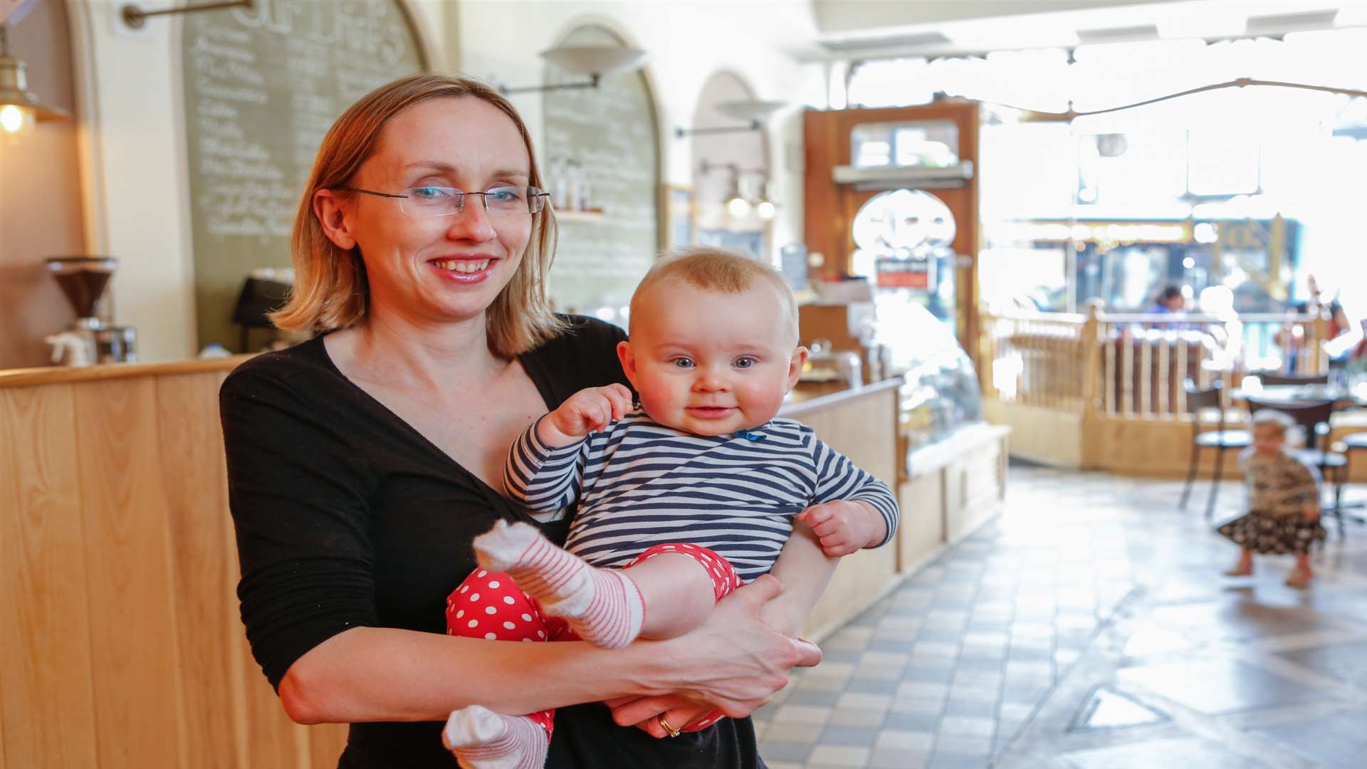 Cllr Jenny Whittle with daughter Olivia at Pops' Cafe in High Street, Maidstone. Picture by Matthew Walker.