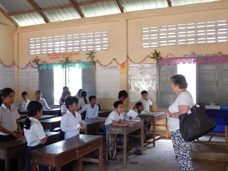 Patsy pictured speaking to pupils in Cambodia
