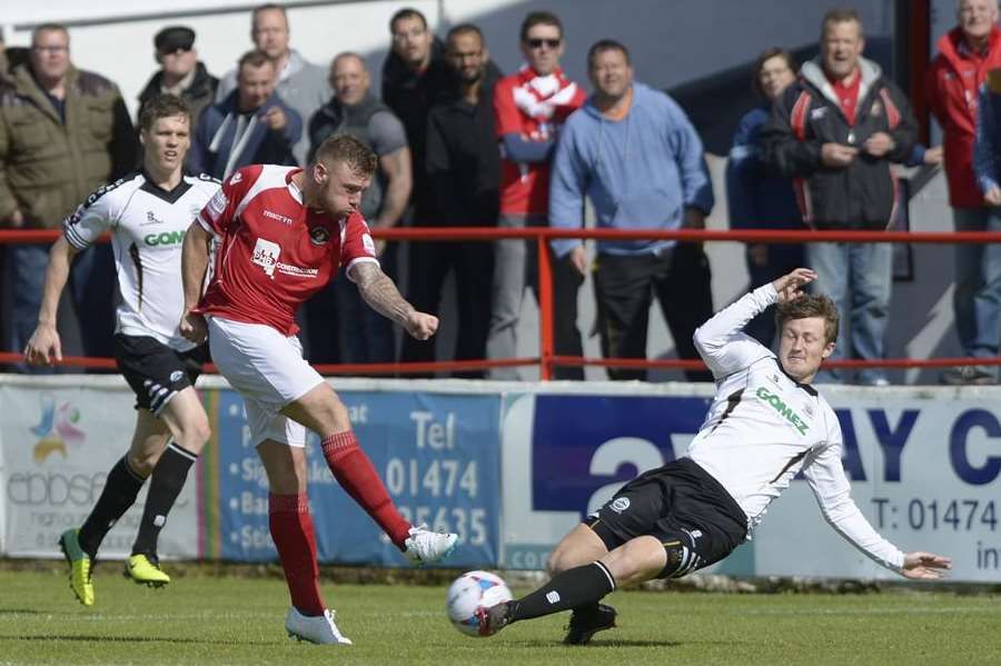 Fleet's Billy Bricknell is thwarted by Dover's on loan Gills man Callum Davies. Picture: Andy Payton