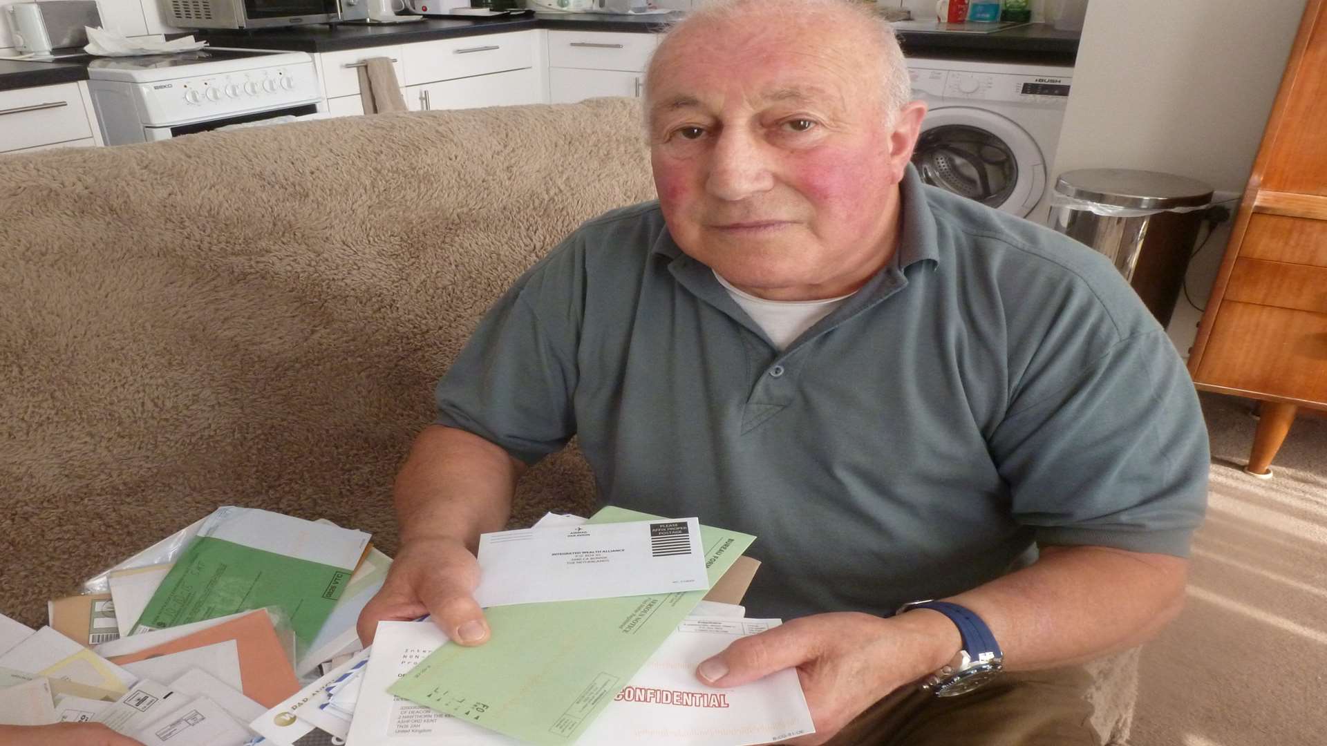 Colin Deacon with some of the scam letters