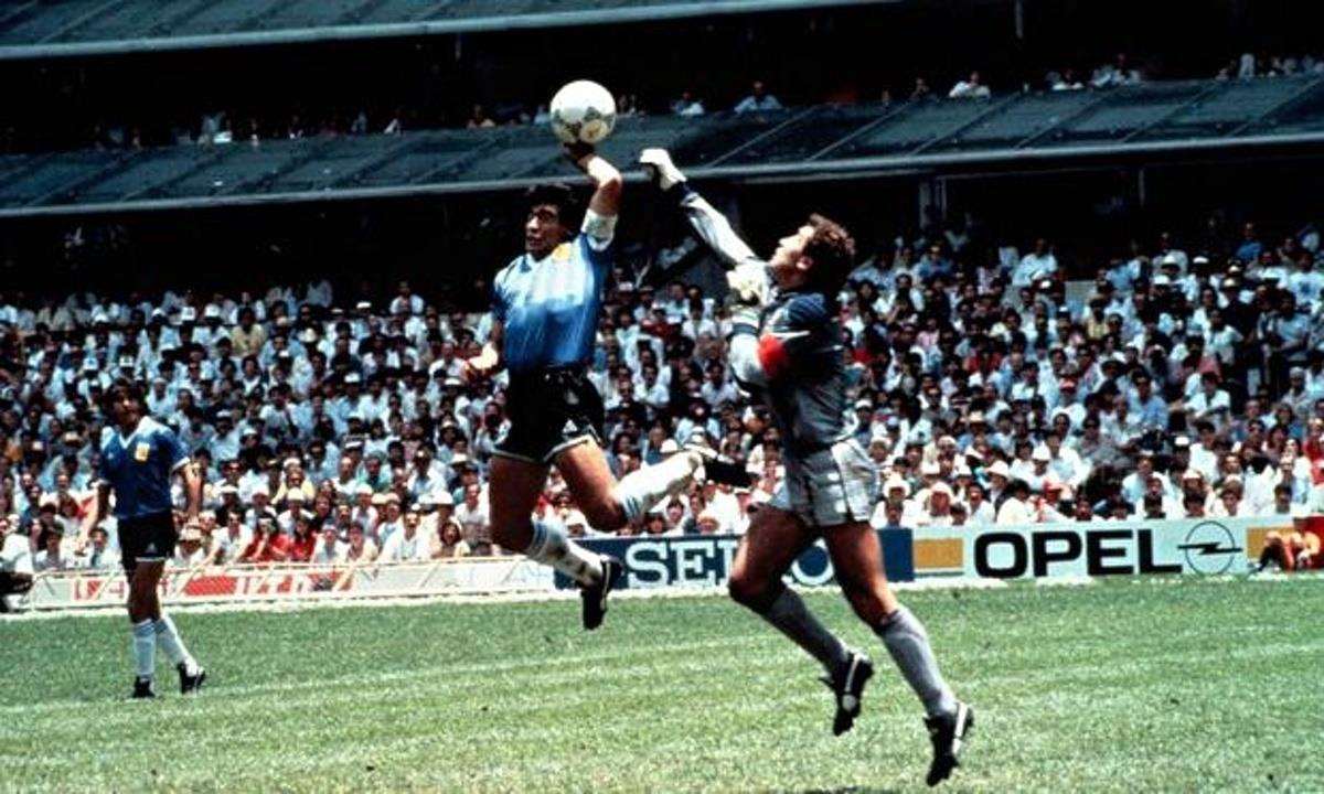 Argentina's Diego Maradona scores his infamous 'Hand of God' goal against England goalkeeper Peter Shilton in the 1986 quarter final of the 1986 World Cup quartet final in Mexico. Picture: Wiki Commons