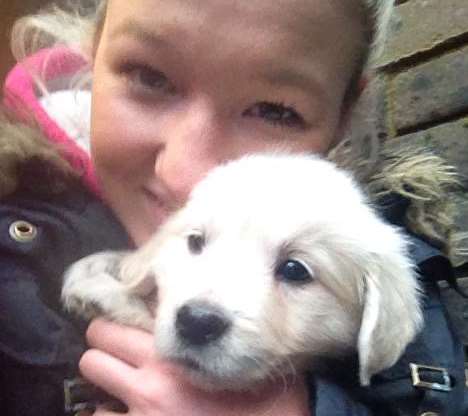 Delighted Jasmin Spinks with one of the rescued puppies