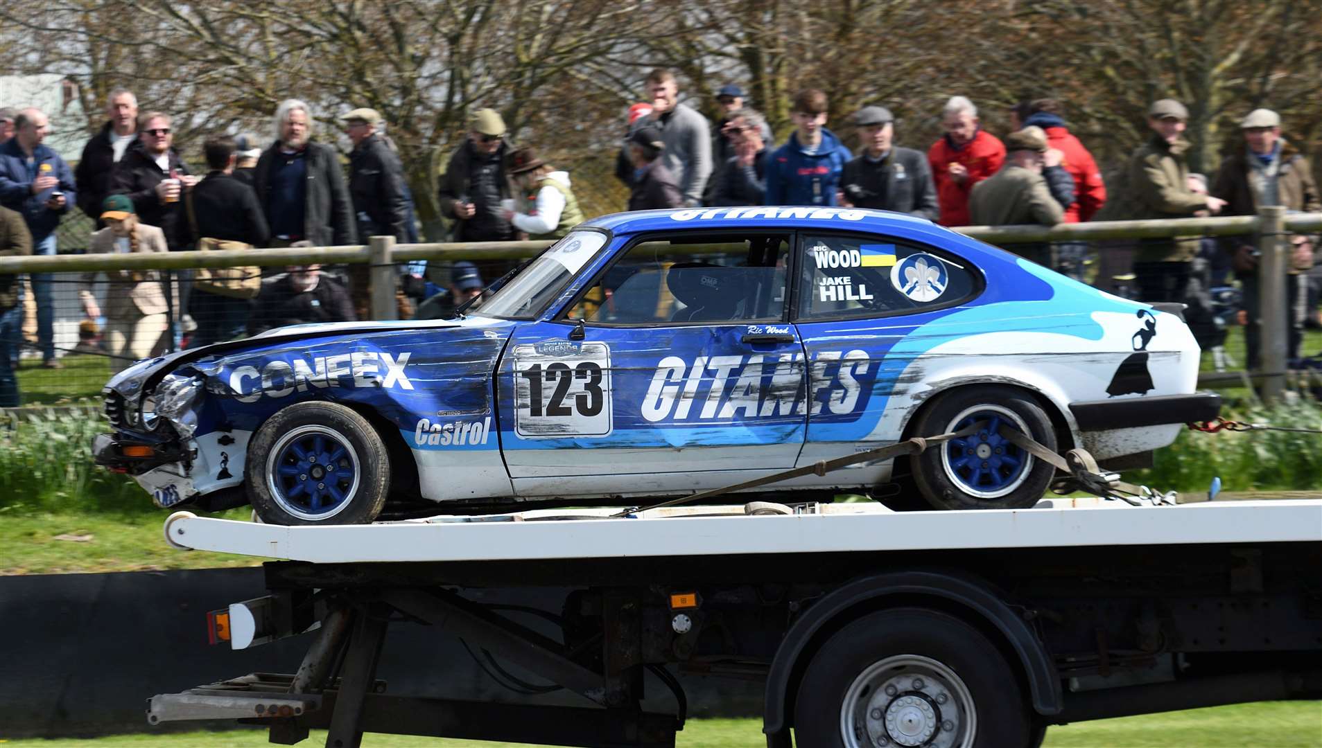 Jake Hill's Ford Capri, is brought back on a truck, after crashing during qualifying. Picture: Simon Hildrew