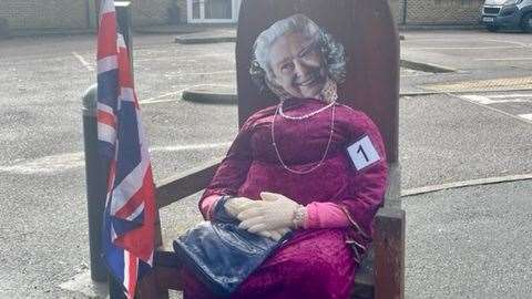 The Queen is outside the village school