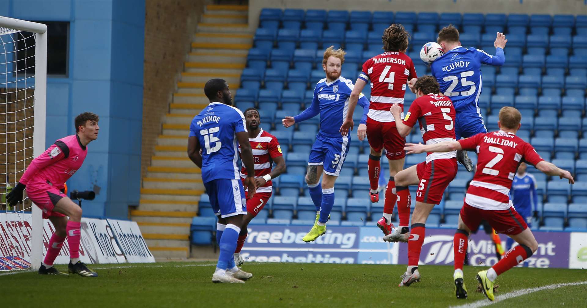 Gillingham defender Robbie Cundy looks to head towards goal against Doncaster. Picture: Andy Jones (45336071)