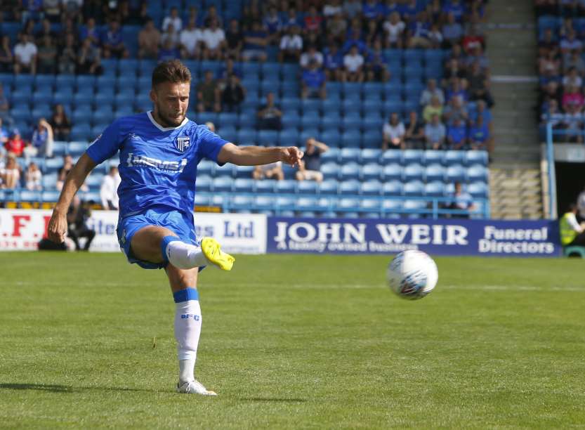 Luke O'Neill puts in a cross for Gillingham Picture: Andy Jones