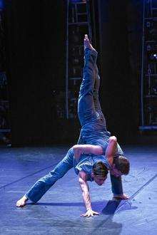Two of the BalletBoyz dancers practising contemporary ballet moves.