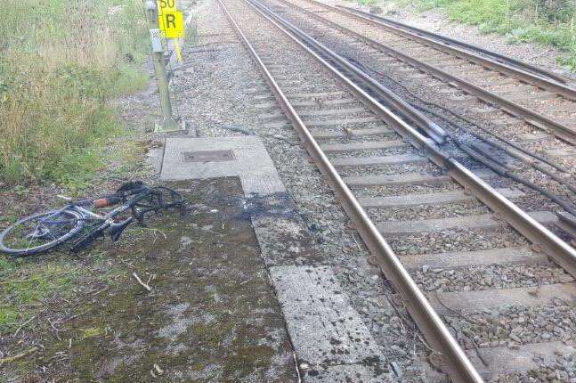 This was the scene after a man's bike was wheeled over train tracks and caught fire. Picture courtesy: British Transport Police Kent