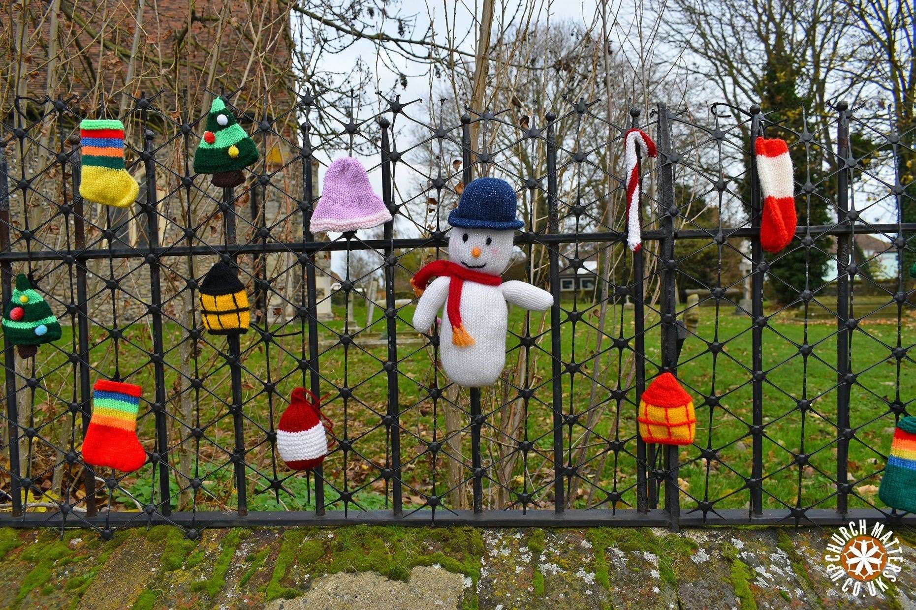 The railings have been decorated with hand-knitted characters. Picture: Upchurch Matters