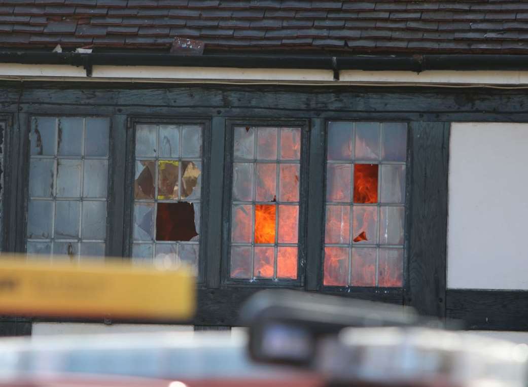 The flames inside the old pub. Picture: Daisy Read