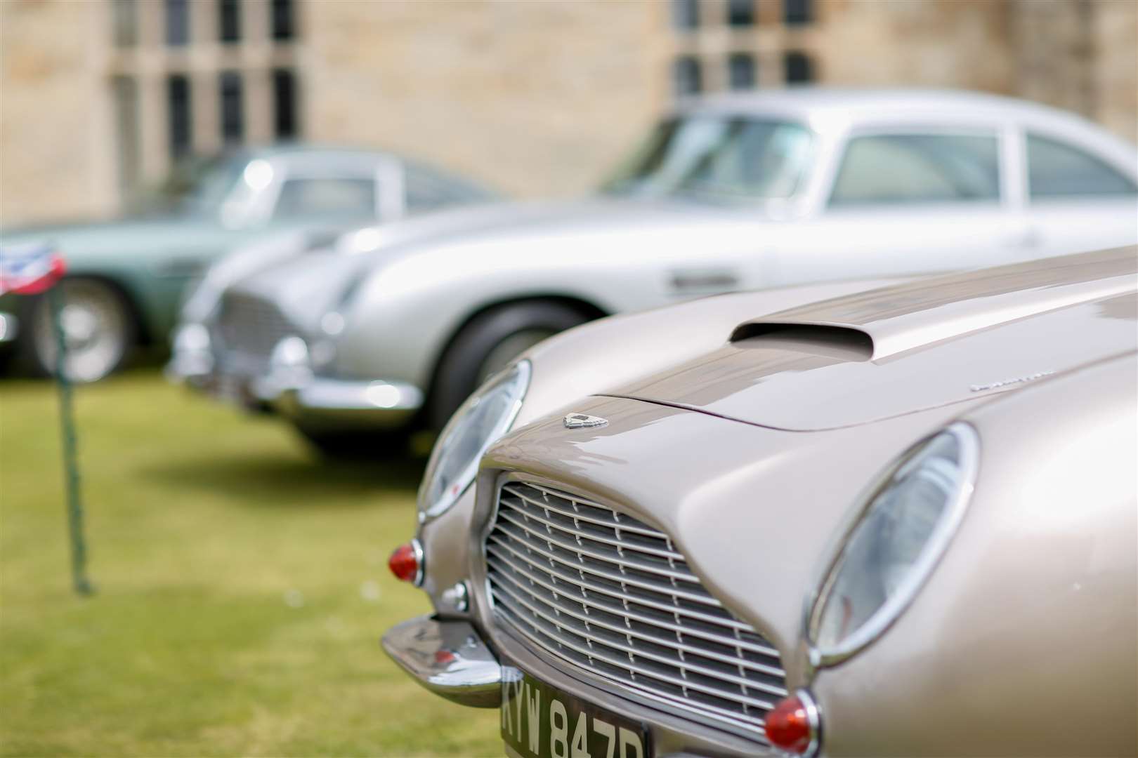 Classic Aston Martins on the island lawn at Leeds castle. Picture by: www.matthewwalkerphotography.com