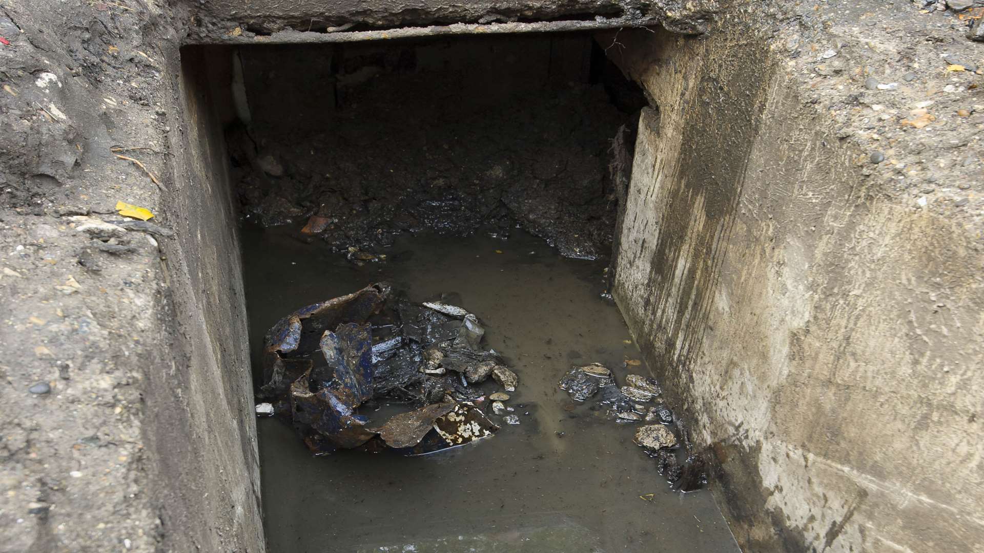 The buried air raid shelter in The Brent, Dartford, is full of mud, water and rubbish. Picture: Andy Payton
