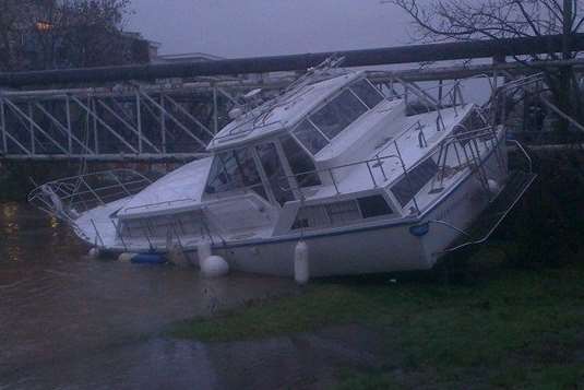 Boat stuck at Tovil footbridge. Picture: George Haswell