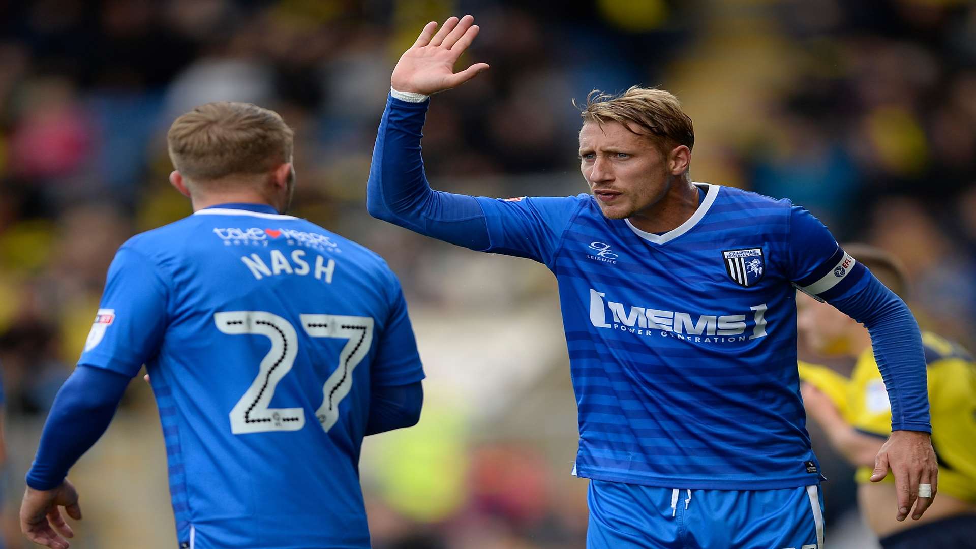 Gillingham captain Lee Martin has a difference of opinion with Liam Nash. Picture: Ady Kerry