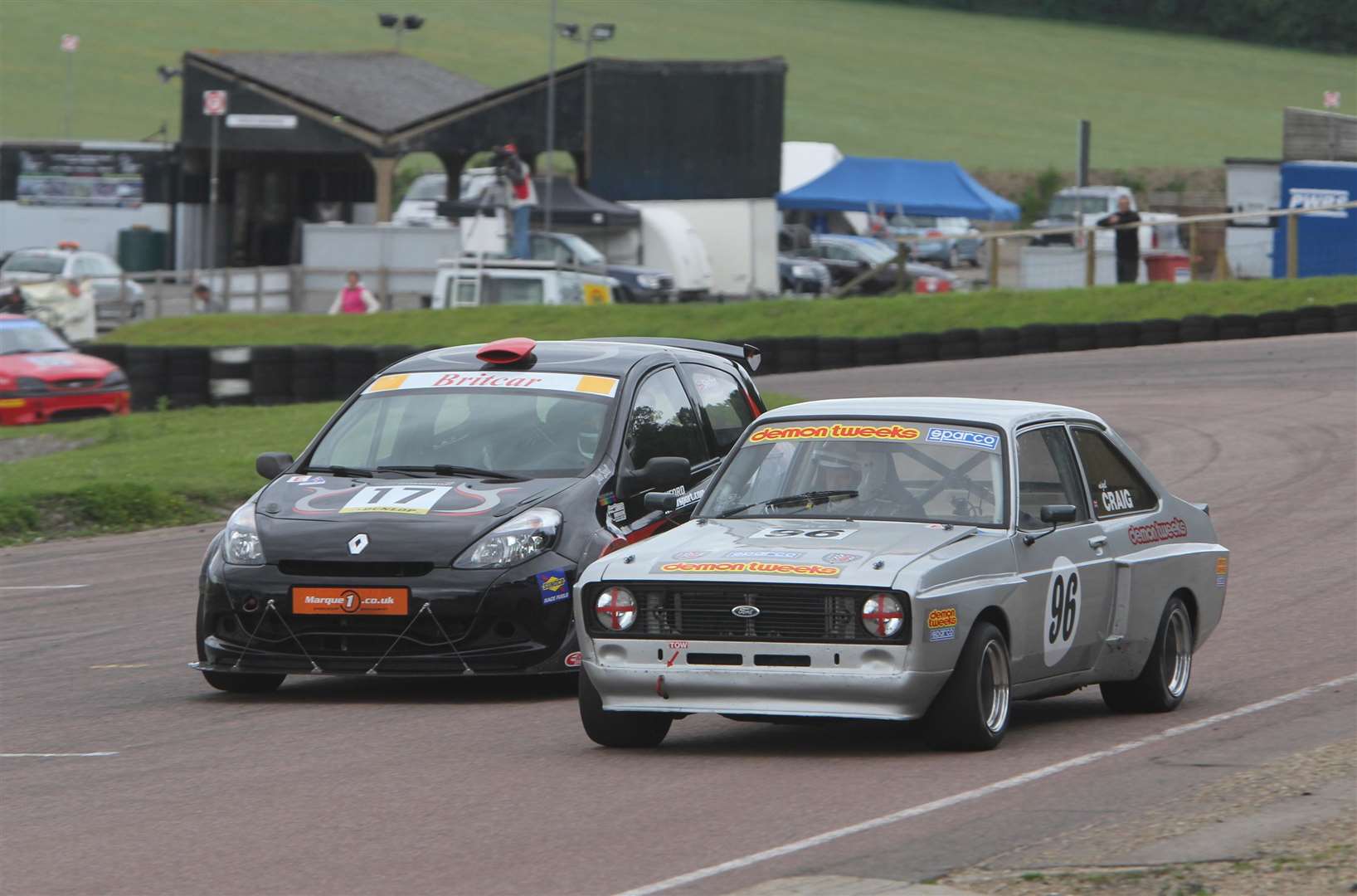 Elham area residents Nigel Craig (right) and Tony Skelton battle it out at Lydden in 2012. The landmark ‘Y’ roof of the former scrutineering bay can be seen in the background. Picture: Kerry Dunlop