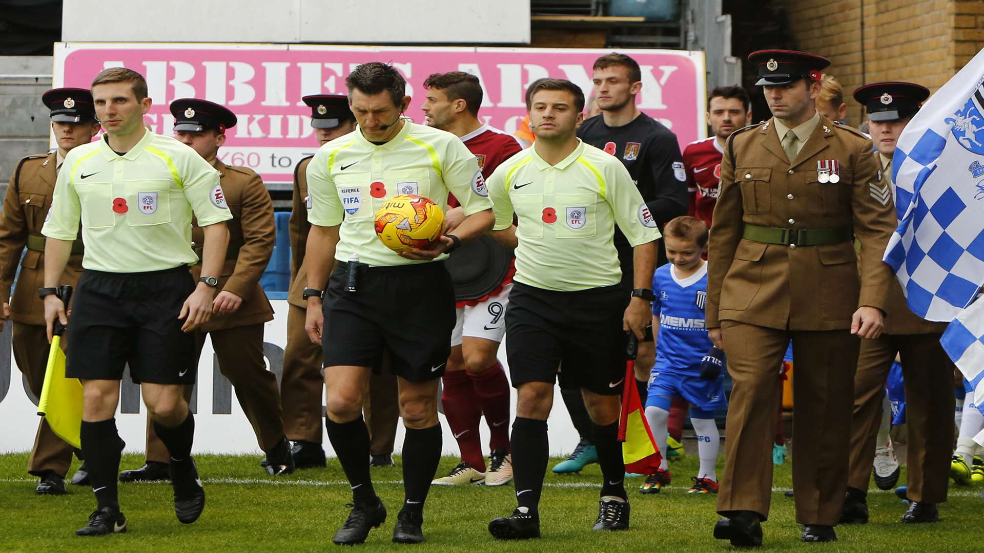 The Royal Engineers lead the players out before remembering those who gave their lives in conflict Picture: Andy Jones