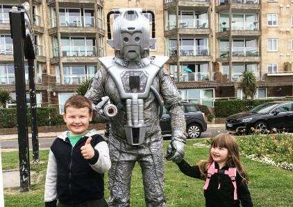 Children making friends with a Cyberman. Picture: Celine Stephens