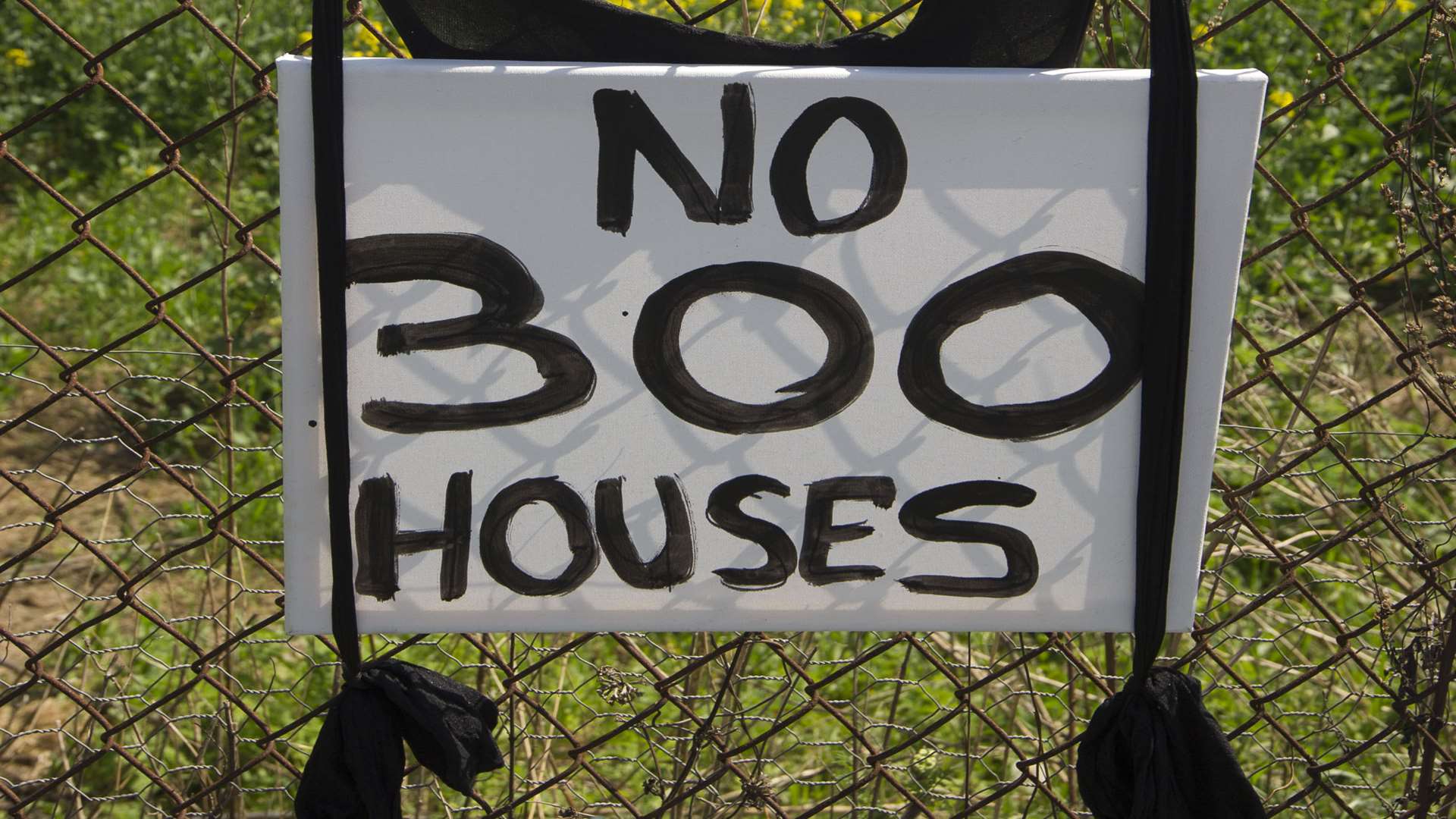 Nearby residents have put up signs protesting against the proposed housing