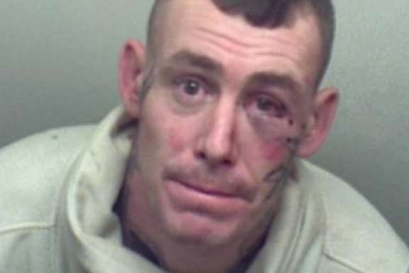 Tattooed thug Martin Stone has been jailed for two years