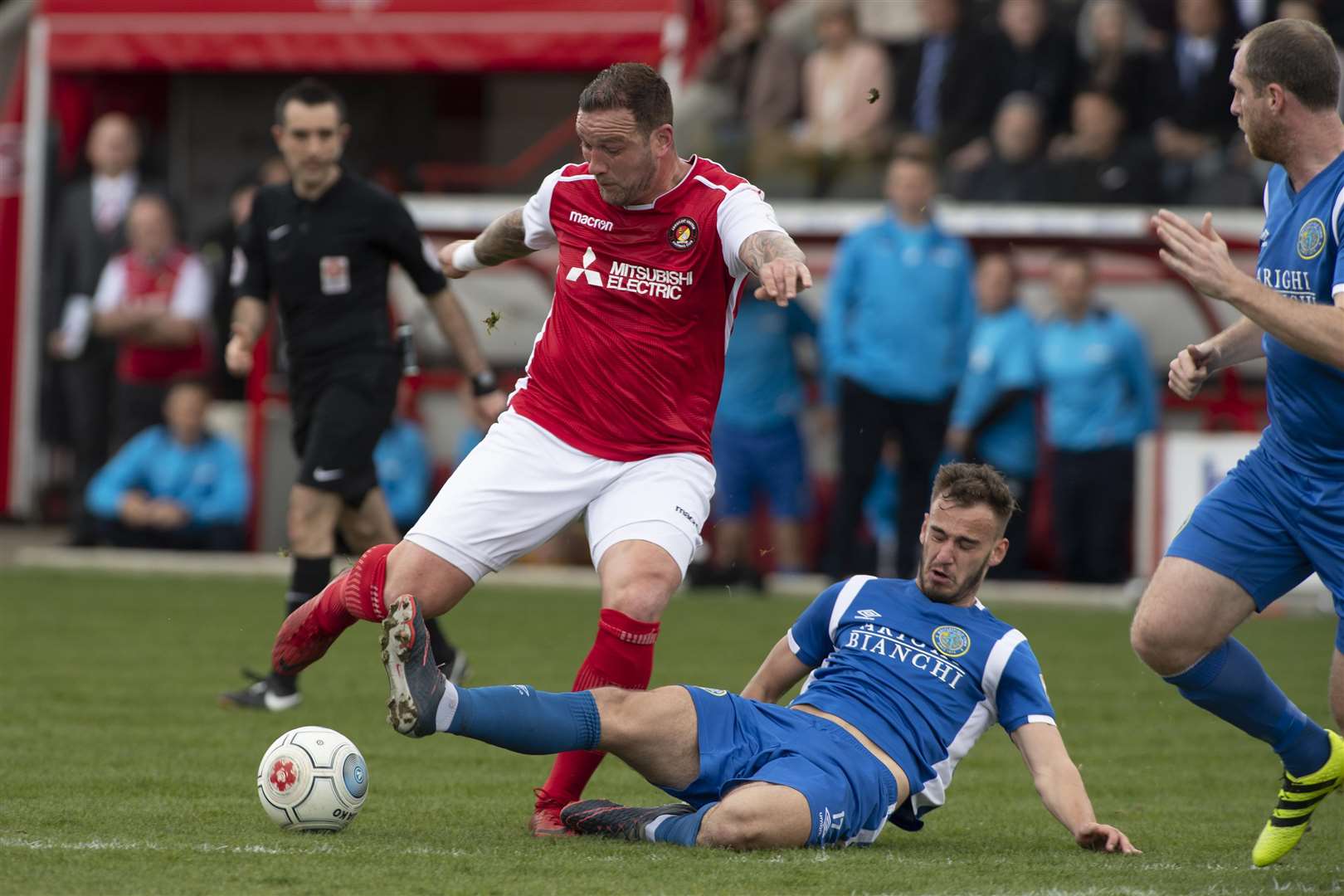 Danny Kedwell is tackled by Callum Evans. Picture: Andy Payton