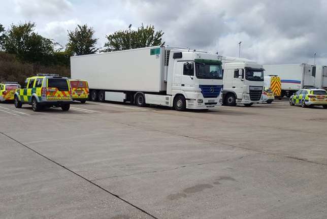 Police vehicles surrounding the lorry. Picture: Carl Woodley