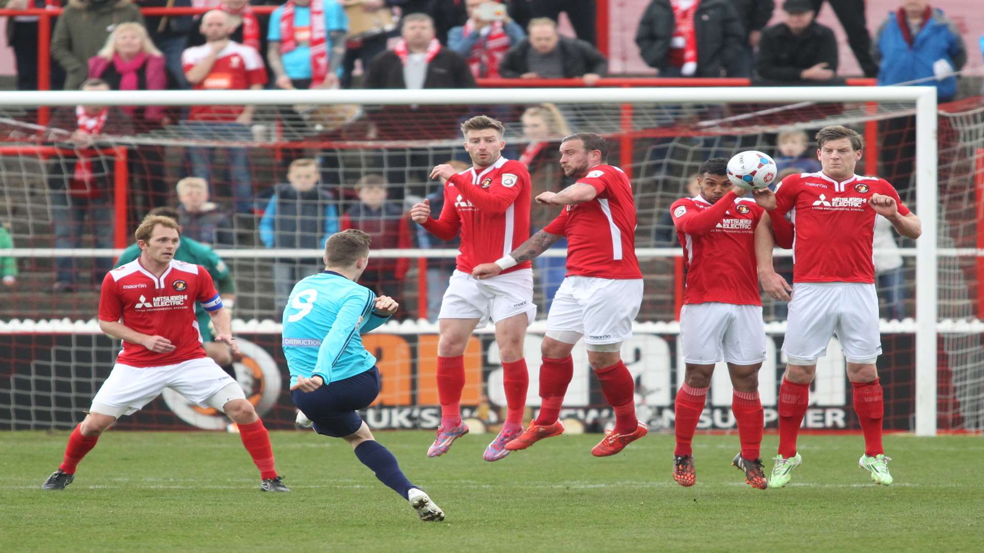 Whitehawk's Jake Robinson hit the post with this free-kick Picture: John Westhrop