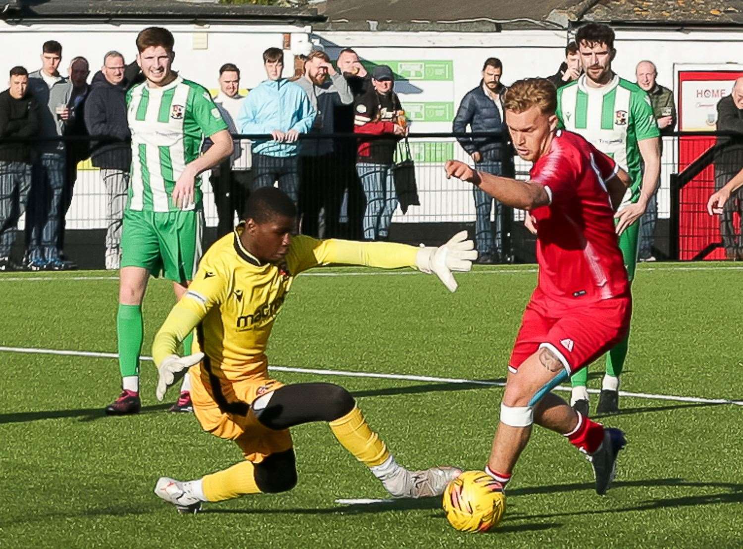 James Jeffrey gets around Rusthall keeper Serine Sanneh to score Whitstable's third goal last Saturday - only to collect a red card two days later against Deal. Picture: Les Biggs