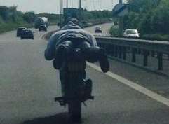 Biker pictured planking on dual-carriageway