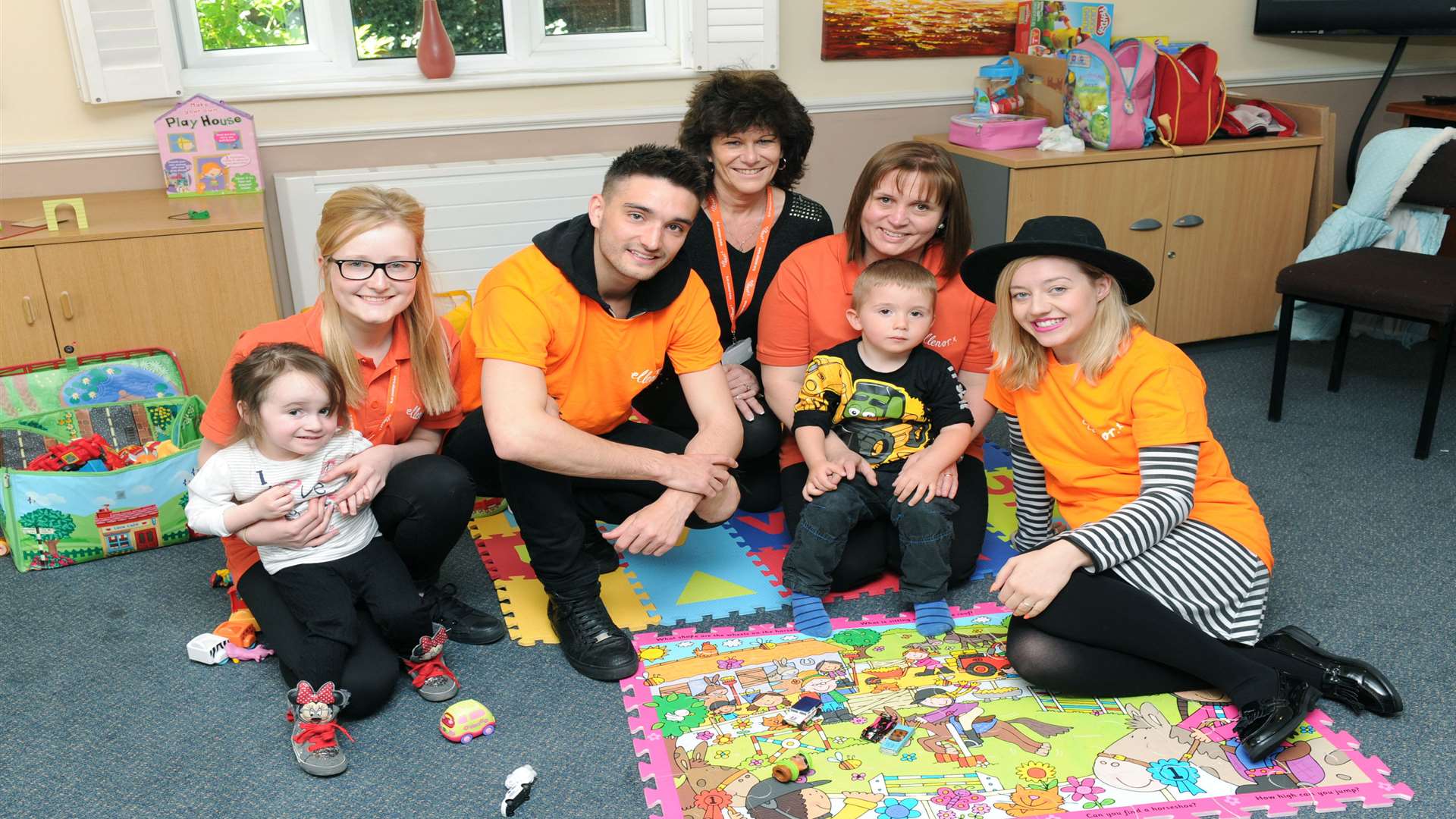 Tom Parker with (l-r) respite support worker Melissa Hirst, respite co-ordinator Tina Humphreys, respite support worker Vicki Stanford and actress Kelsey Hardwick, and children supported by ellenor