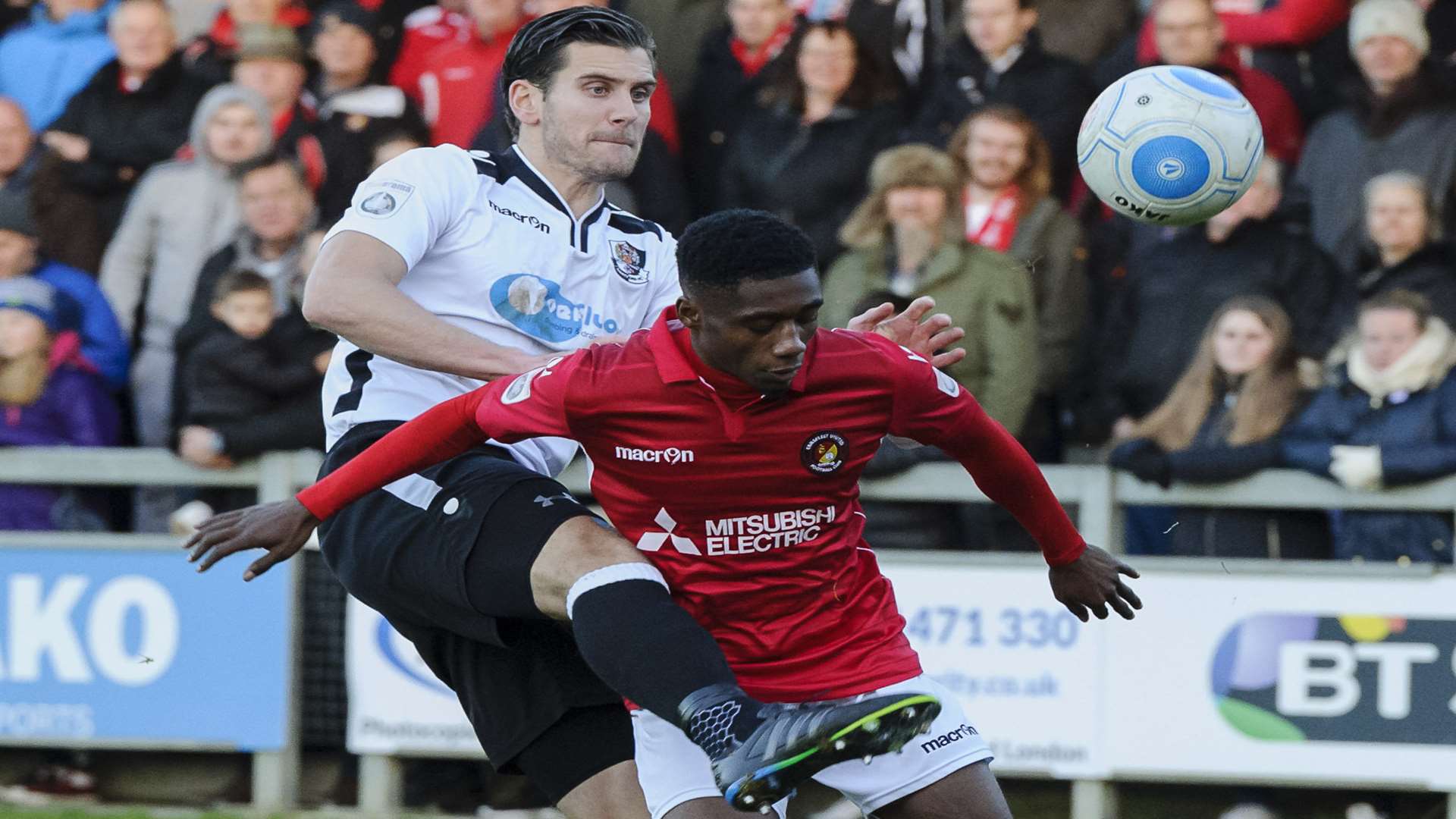 Dartford's former Ebbsfleet player Tom Bonner kept busy by Darren McQueen on Boxing Day Picture: Andy Payton