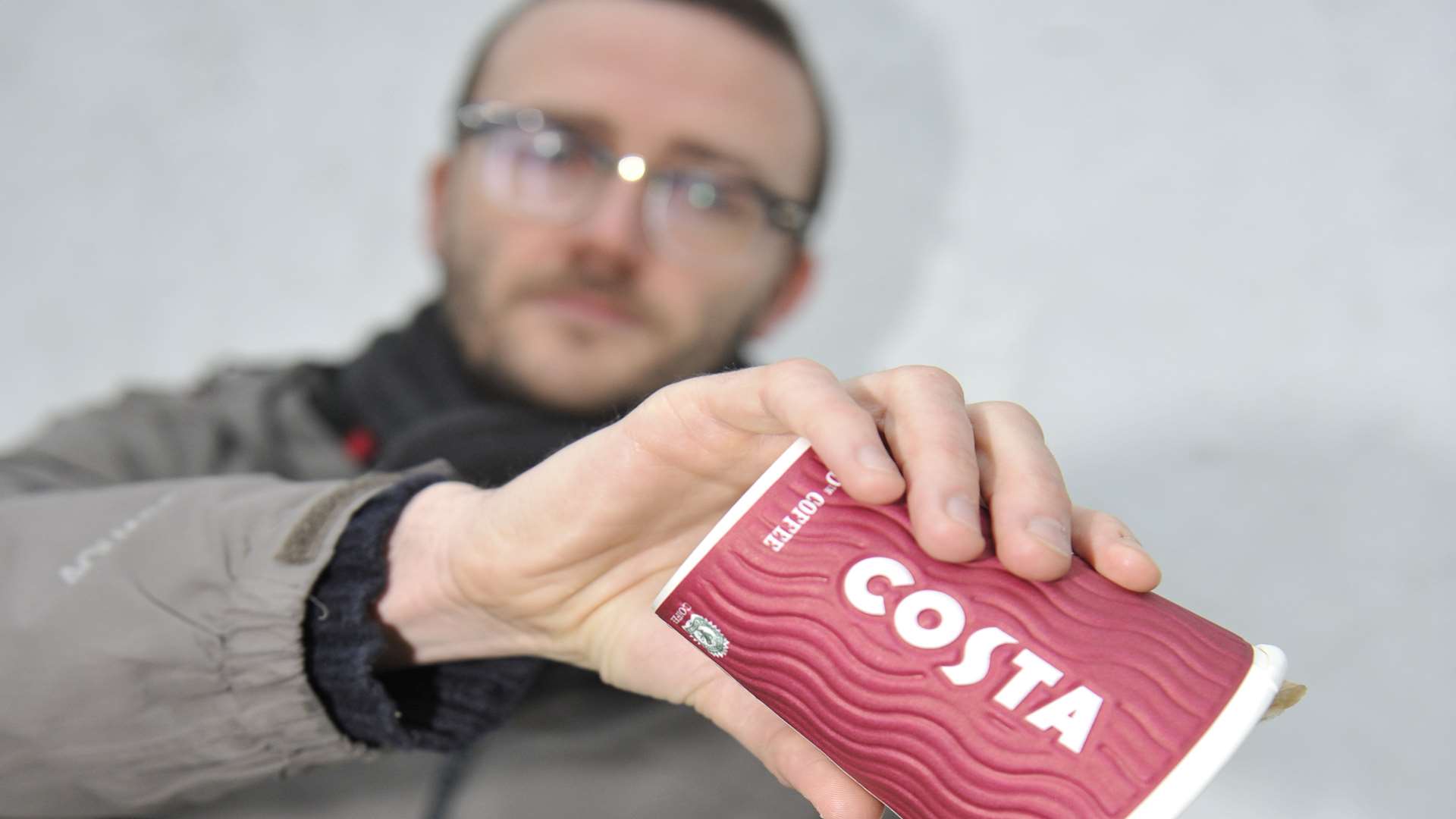 Gavin McGregor pours away a cup of Costa coffee