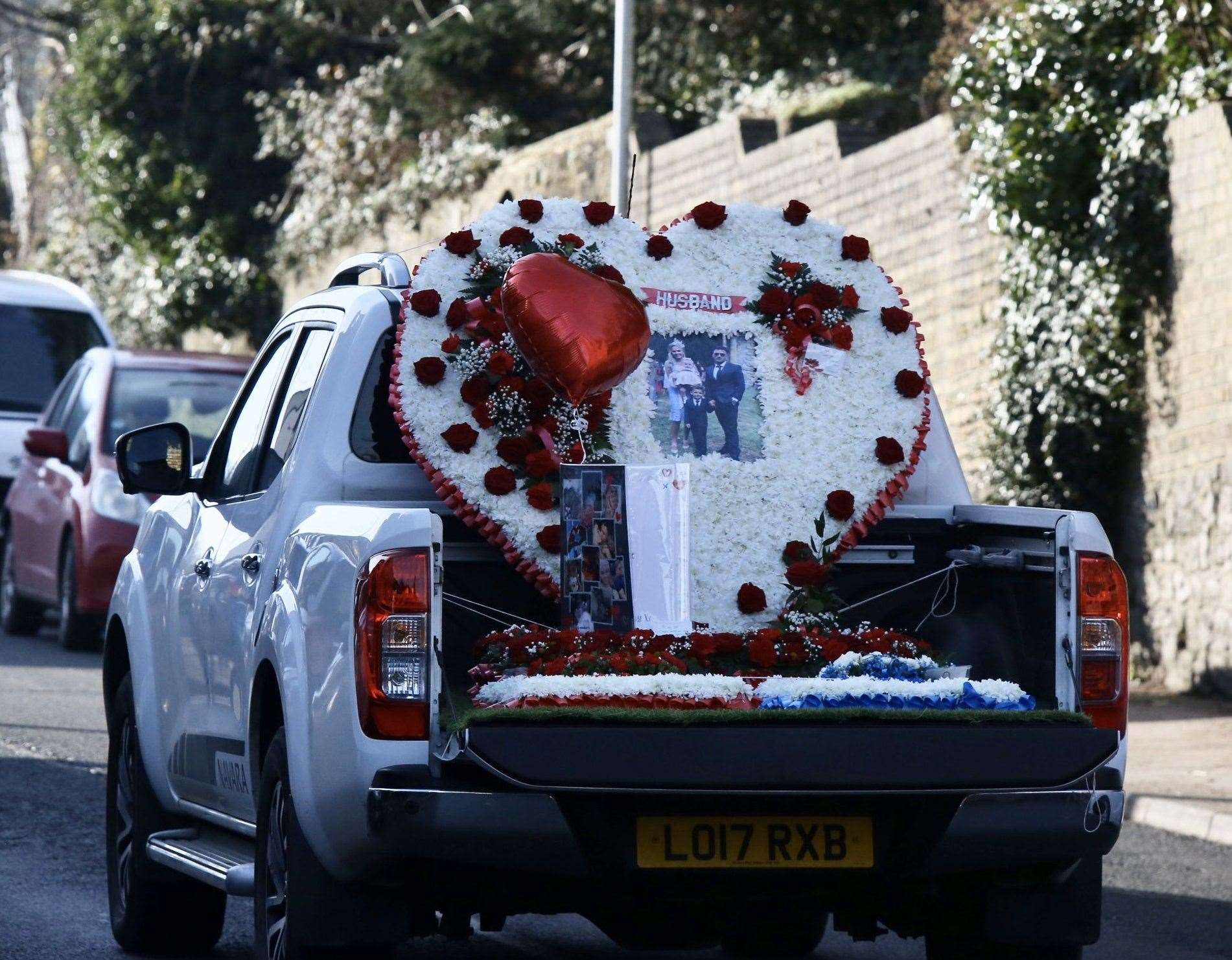 A 4x4 carrying a huge heart made of flowers. Picture: UKnip