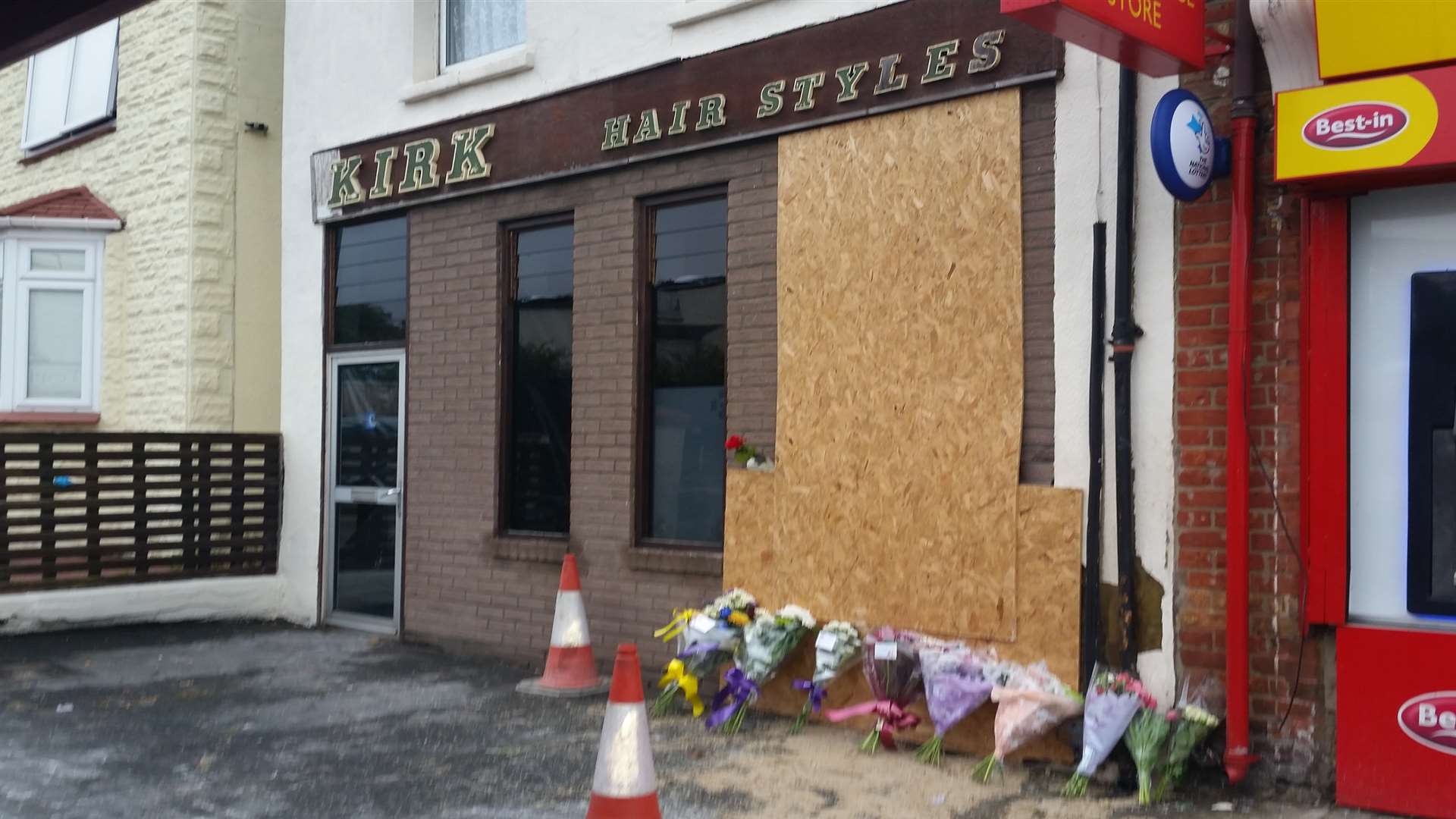 Bouquets of flowers have been left outside the hairdressers