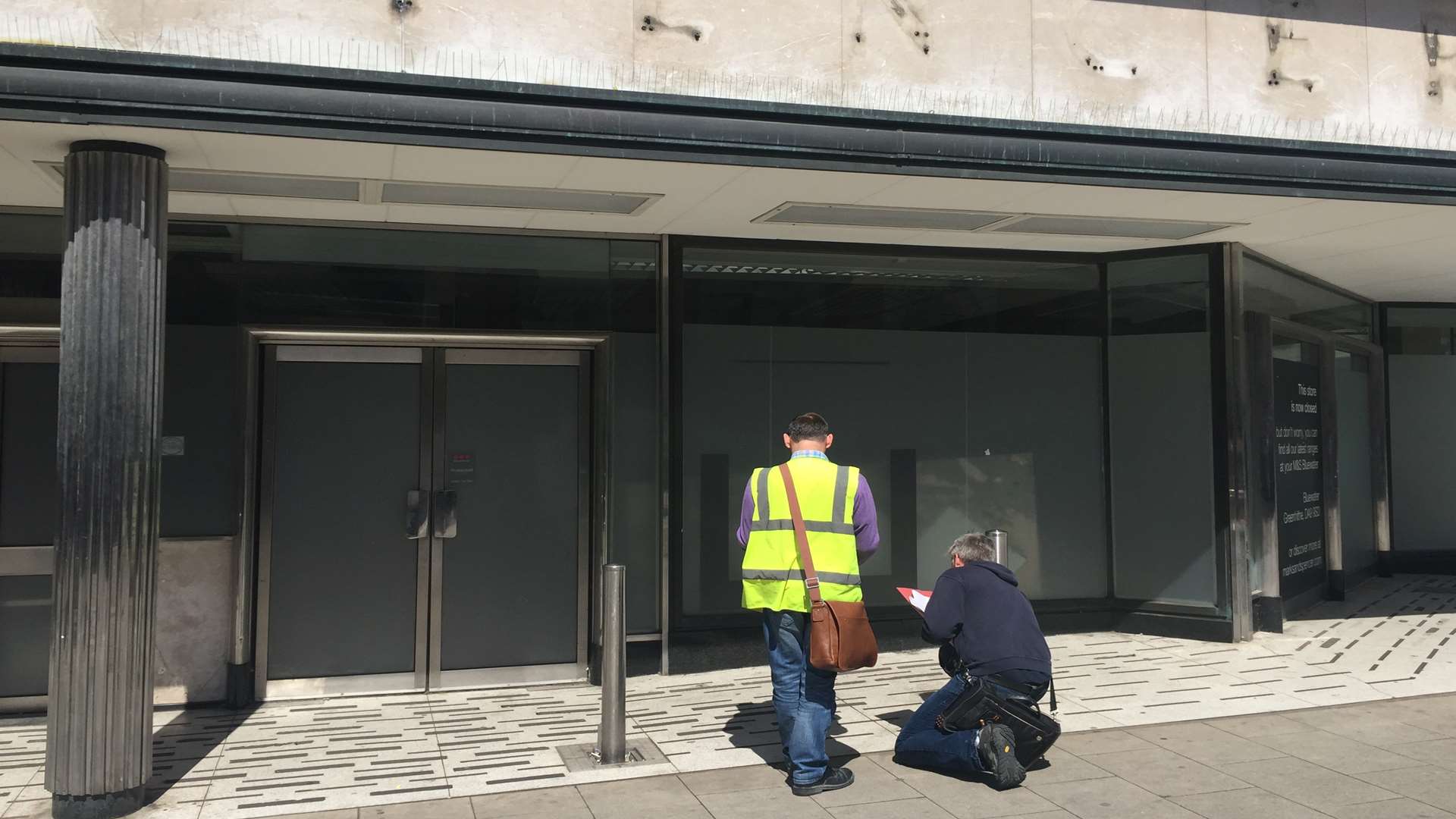 Contractors measuring up outside the old Marks and Spencer store in New Road