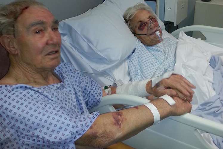 Holding hands, couple Jean and John McDougall in hospital after being attacked