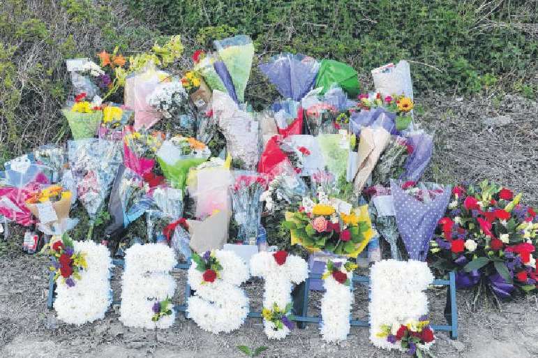Floral tributes mount for David Rose