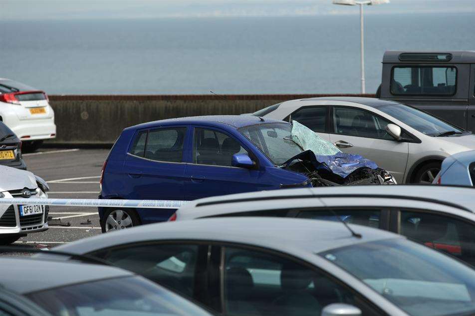 A blue car damaged after the A20 crash at the Megger car park in Dover