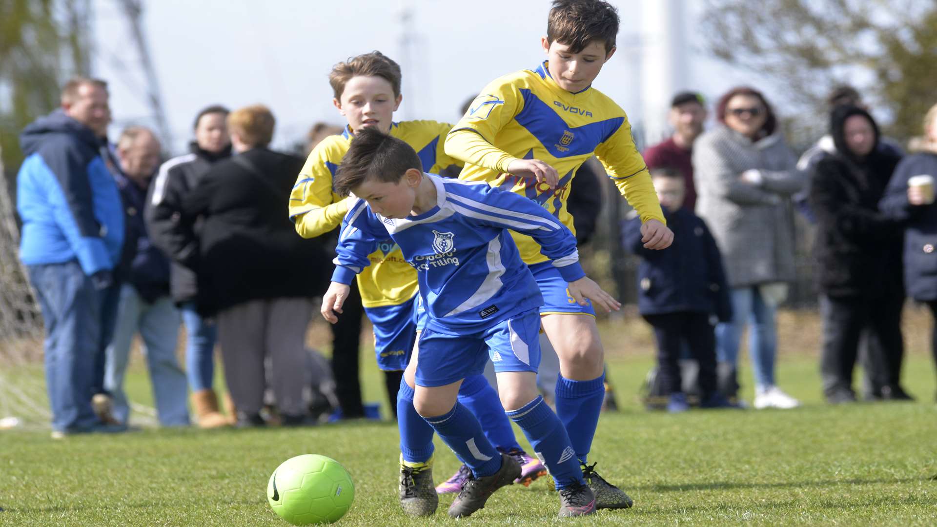 New Road Blues under-10s (blue) battle Sheerness East Picture: Ruth Cuerden