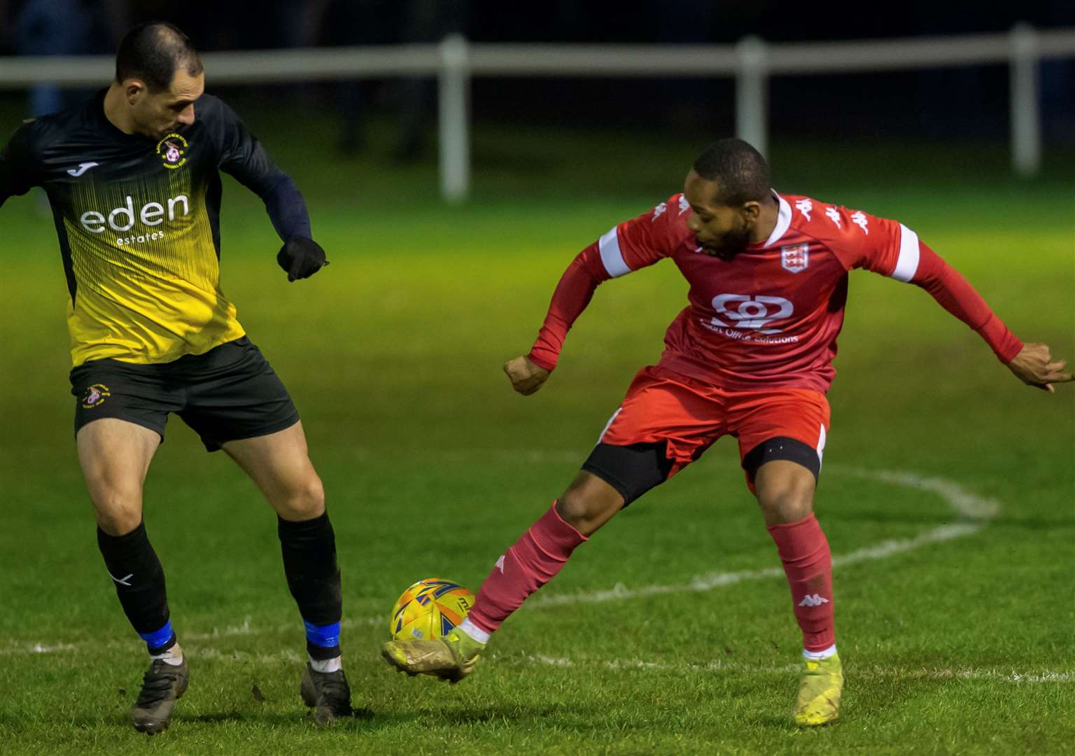 Kieron Campbell, of Faversham, tries to get the ball past Larkfield & New Hythe's Jack Sammoutis. Picture: Ian Scammell