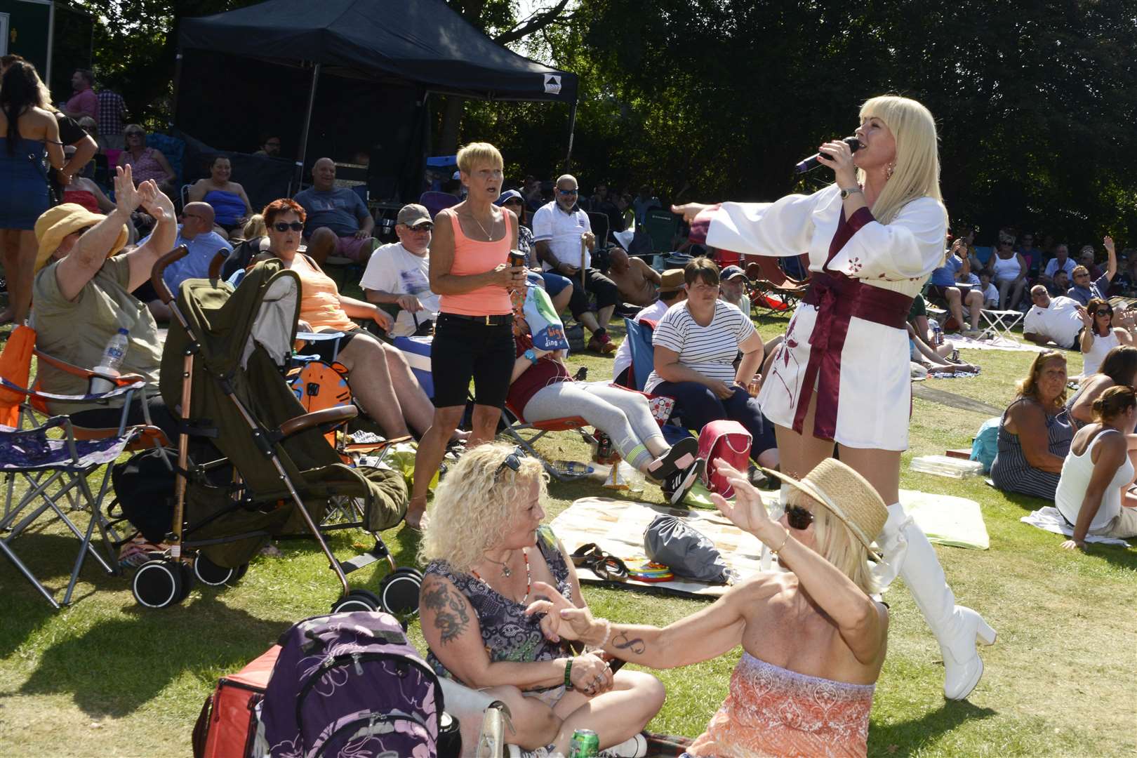 An Abba tribute joins the crowds for a singalong at a previous festival