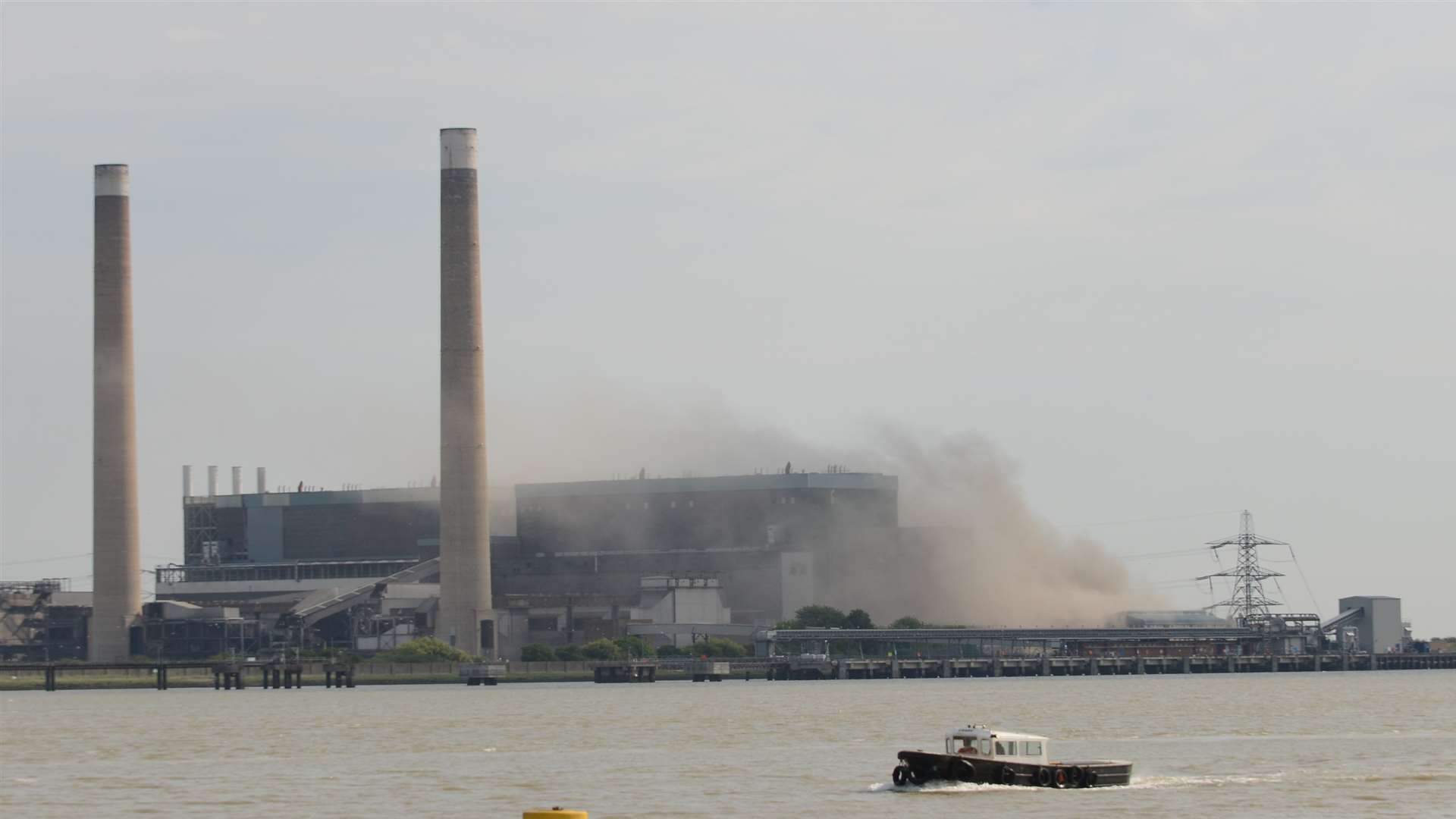 Smoke rises into the air after the fourth controlled explosion. Picture: Gary Browne