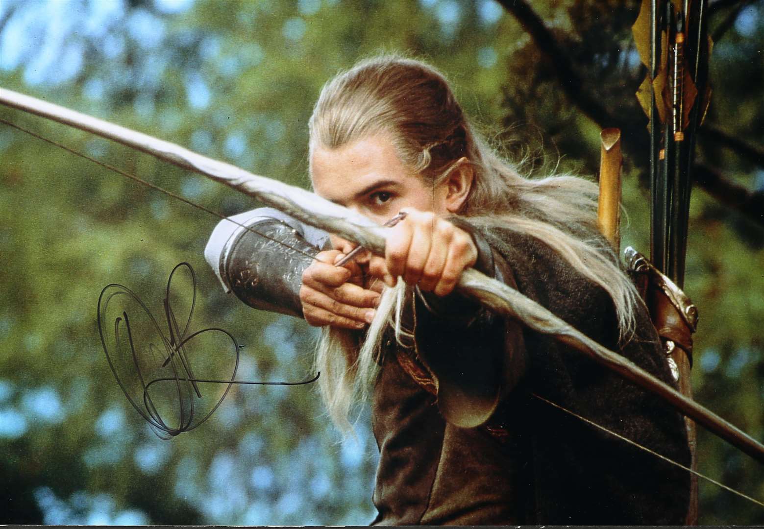 Orlando Bloom as Legolas, using his famous bow and arrow