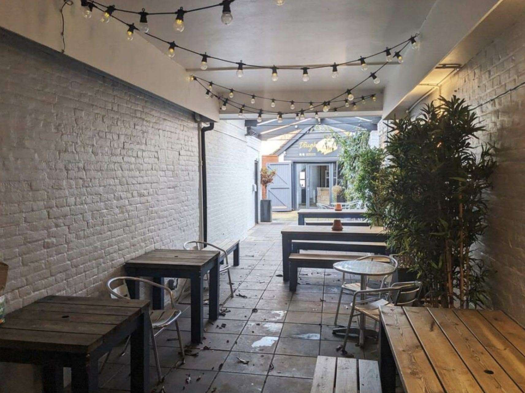 The garden has a pizza restaurant at the back. Picture: Christie&Co/Rightmove