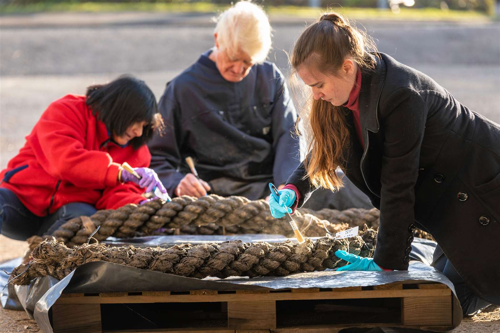Volunteers helping to conserve rope recovered from the wreck. Picture: Christopher Ison/National Museum of the Royal Navy
