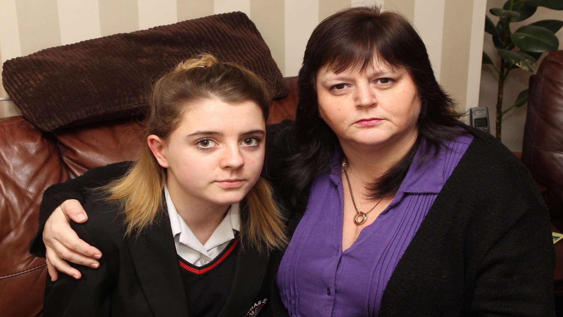 Katy Webb, 14, who was attacked by a group of girls, with her mum Sara
