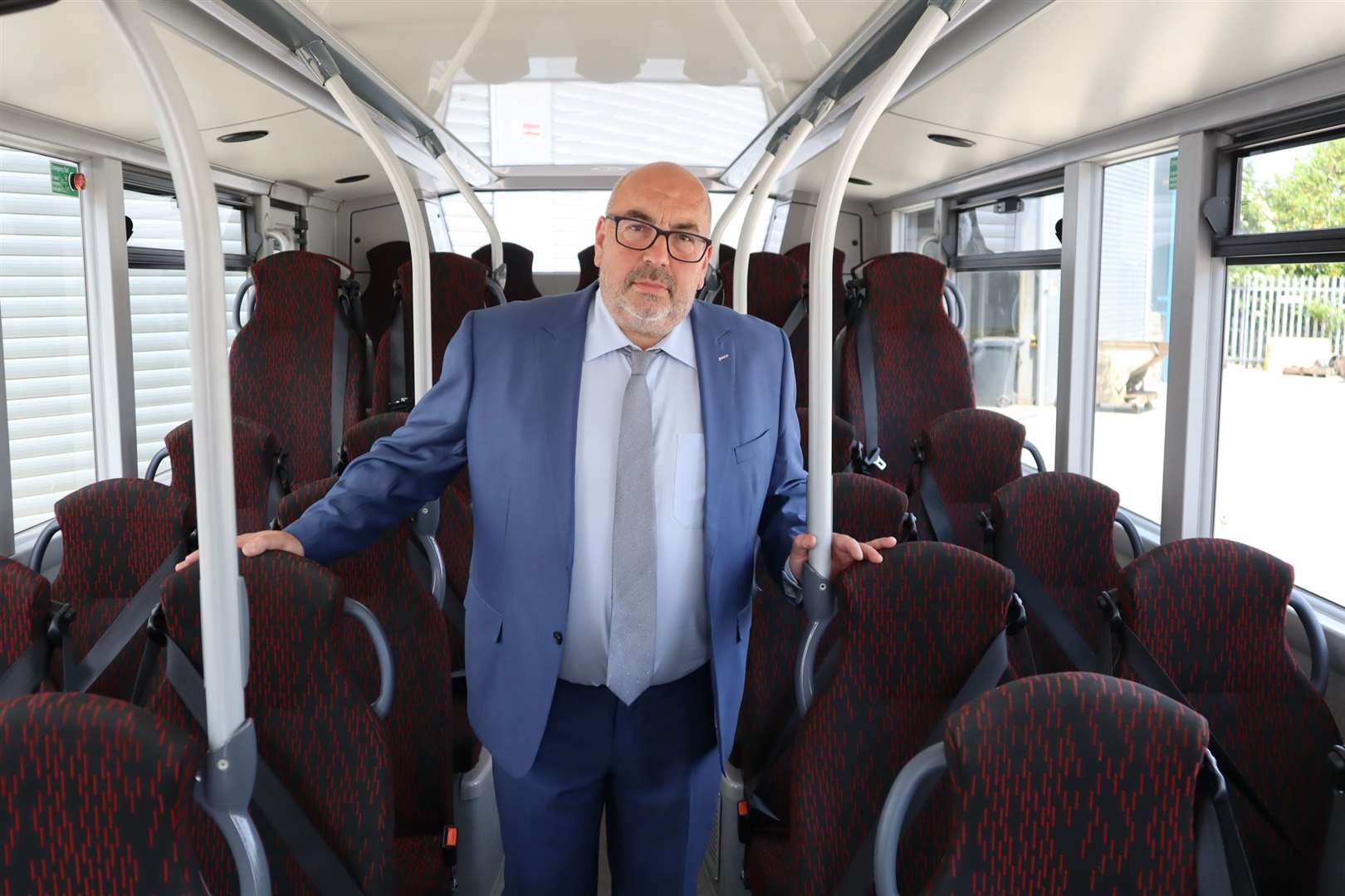 Tim Lambkin, managing director of Sheppey coach firm TravelMasters checking out spaces on a bus