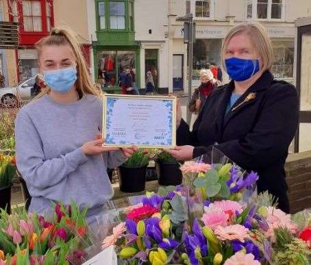Grace Creasey is awarded for her work at Frendy'ss Flowers on Deal Market. Pictured with town clerk Lorna Crow